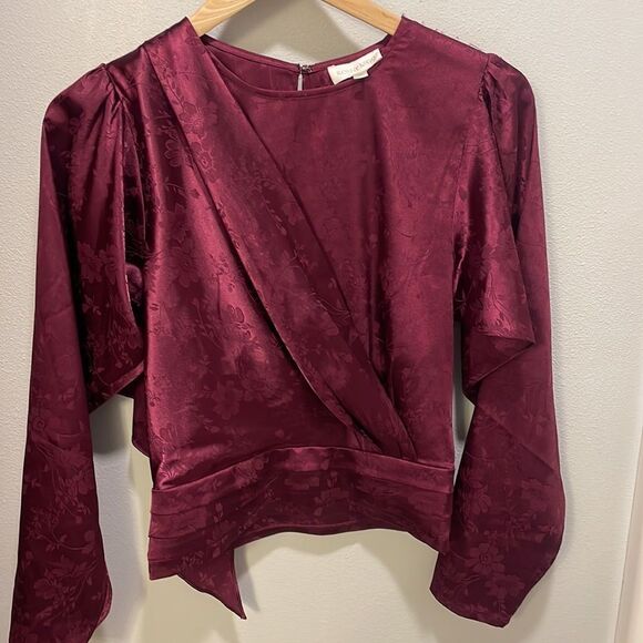 Nwot Ronny Kobo Collection woman’s maroon long sleeve Flowy blouse.